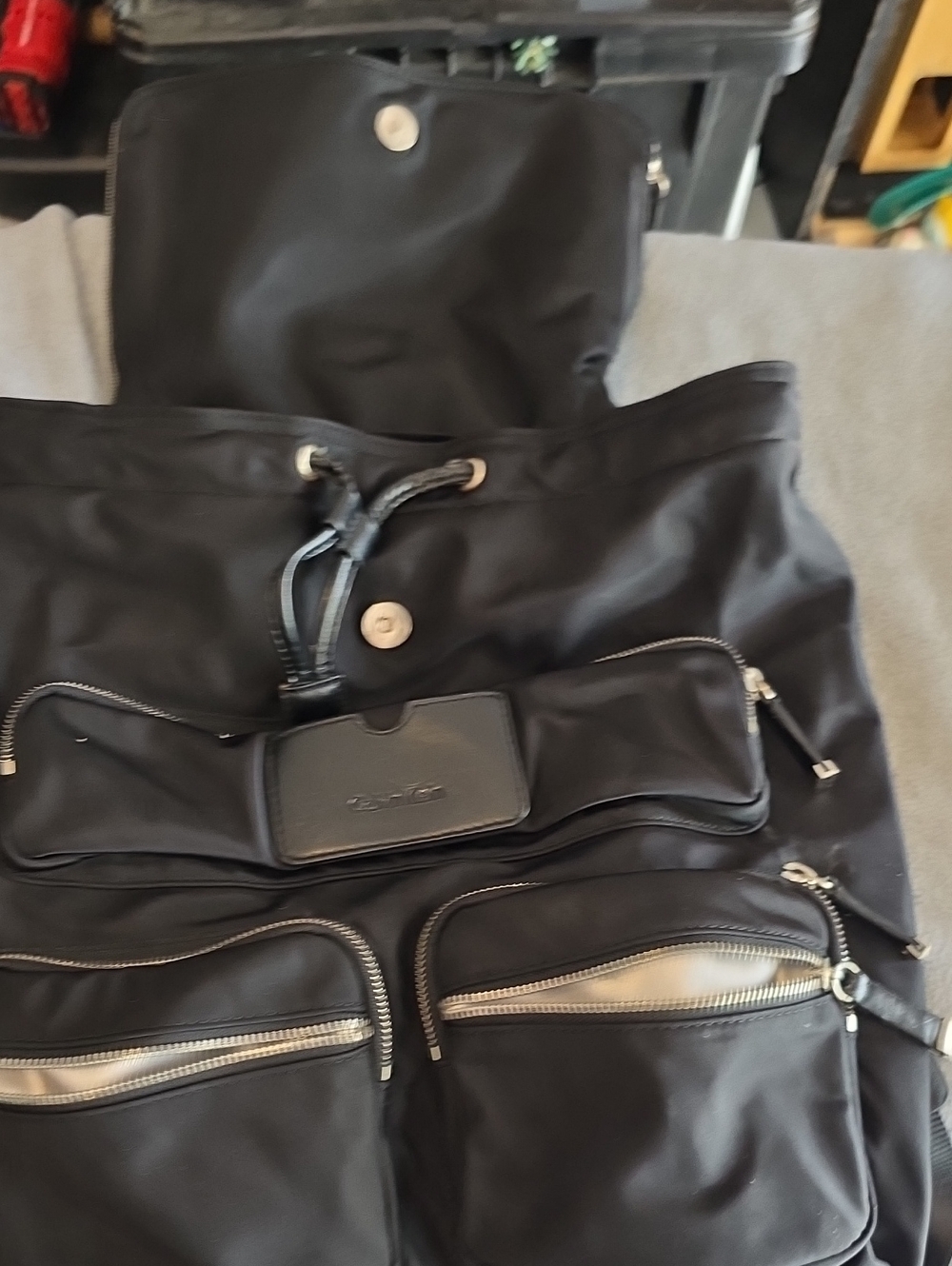 Women's Black Nylon Drawstring Backpack with Front Zip Pockets